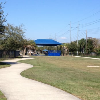 Yucatan Dog Park blue covered pavilion and walking path in Orlando Florida